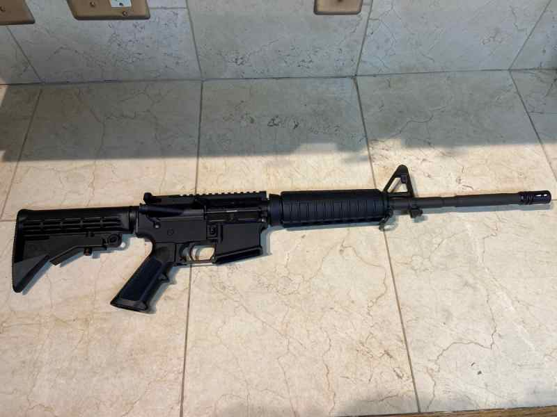 New Bushmaster Ar 15 carbine 556/223