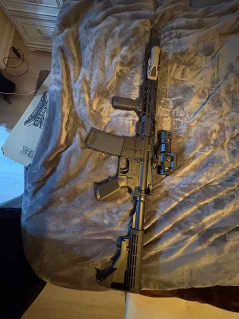 .300 arp / .556 ar with attachments and optics.