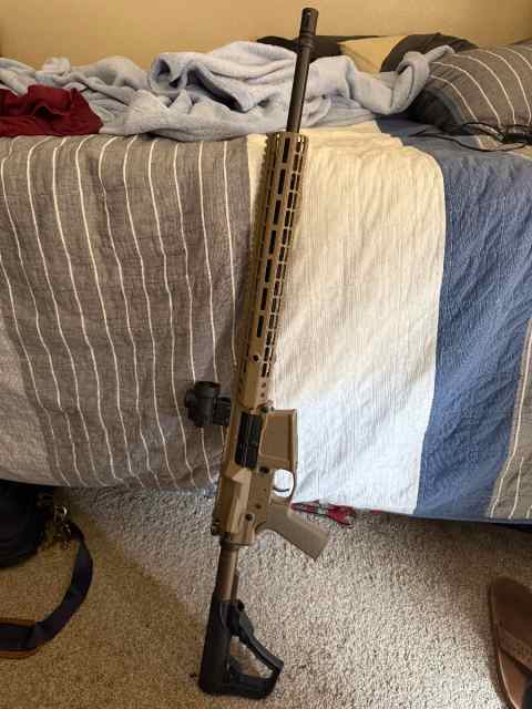 New Never Been shot 308. Aero AR10 with Trijicon M